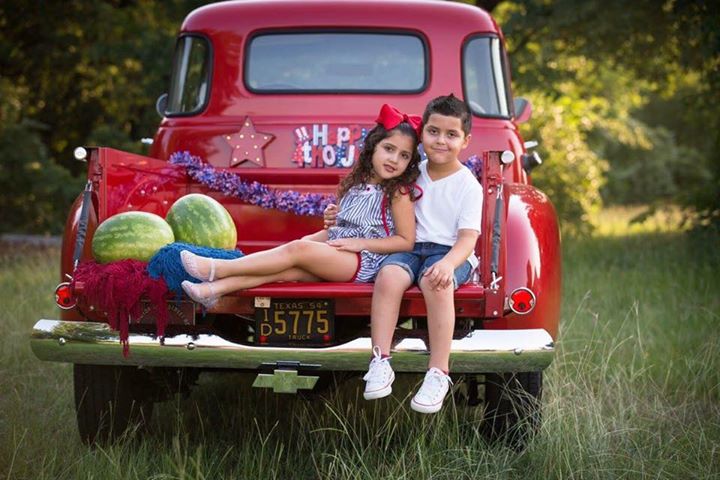 4th of july watermelon in the back of a vintage red radio flyer radio flyer truck