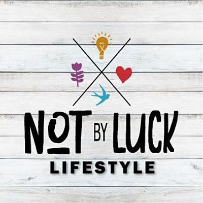 Not By Luck logo