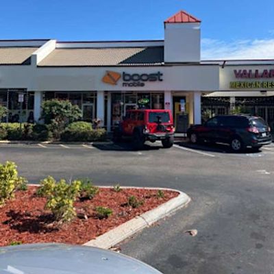 Boost Mobile 56th (813) 899-2088 logo