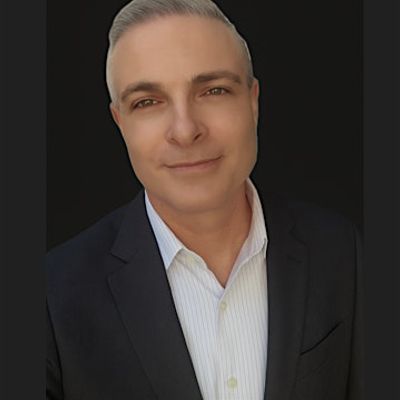 Gil Kauffman - Alamo Title logo